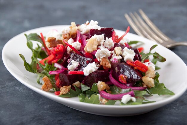 On a gray background a plate with beet salad