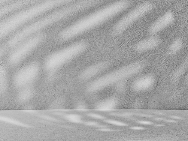 Gray background for product presentation with shadows and light on the wall