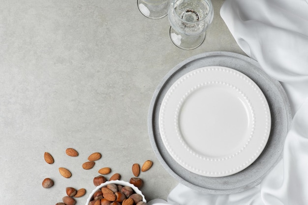 Gray background with a plate and glasses