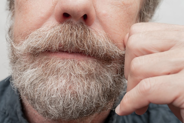 Gray beard and mustache.