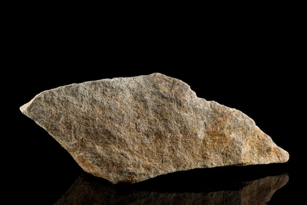 Gray big stone on a black background