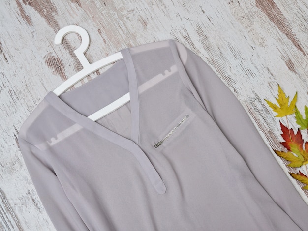 Gray blouse on a hanger