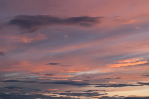 Gray, blue and orange clouds at sunset. Horizontal photo