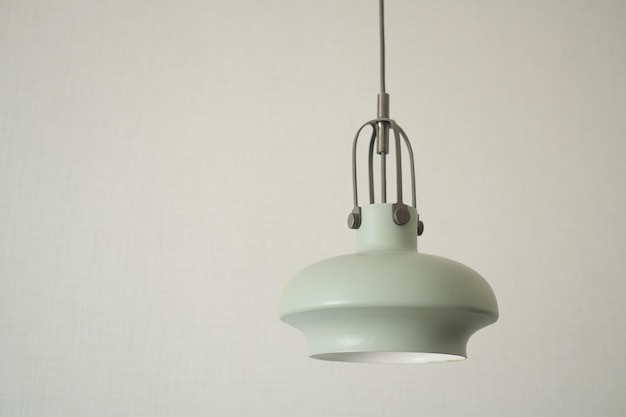 Gray ceiling lamp hanging in a room