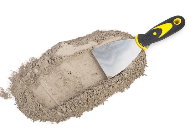 Photo gray cement powder with trowel