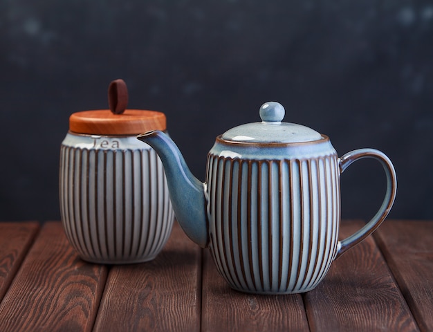 Gray ceramic tea pot on wooden table