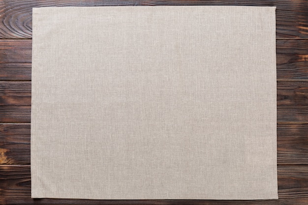 Photo gray cloth napkin on rustic dark
