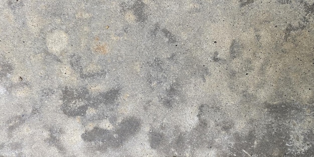 Photo a gray concrete floor with a black and white pattern.