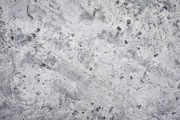 Muro di cemento grigio come sfondo. primo piano di pietra di struttura