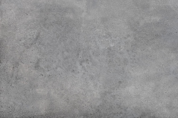 Gray concrete wall background with texture and scuffs