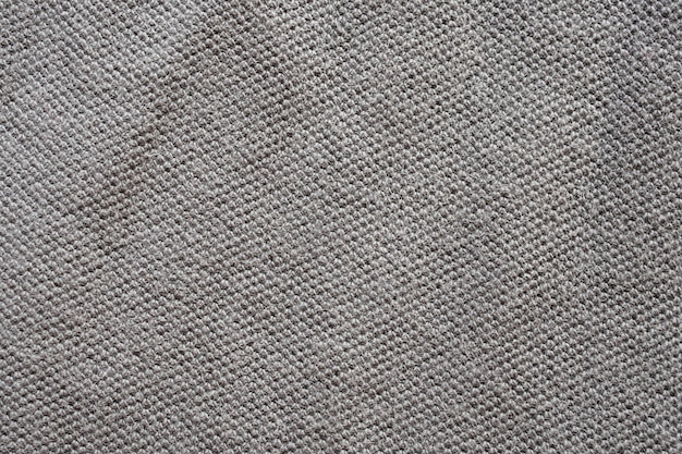 Foto fondo grigio di struttura del tessuto della camicia di cotone
