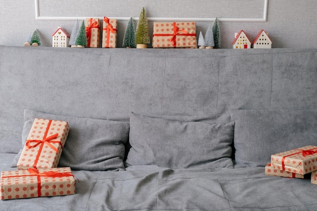 Gray couch decorated with Christmas and New year gifts and baubles in living room No people Home fes