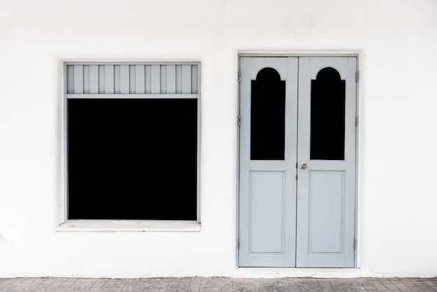 Gray door  on white wall