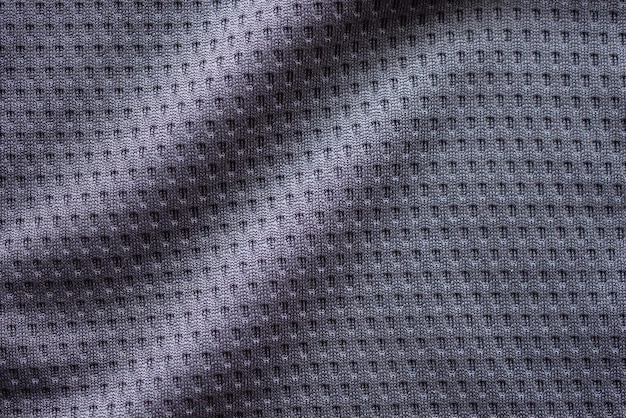 Foto maglia da calcio per abbigliamento sportivo in tessuto grigio con sfondo a trama in rete d'aria