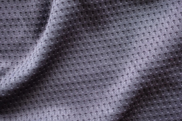 Gray fabric sport clothing football jersey with air mesh texture background