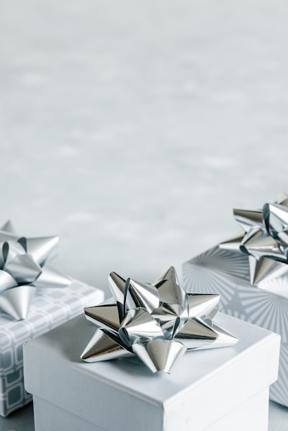 Gray gift boxes with silver bows