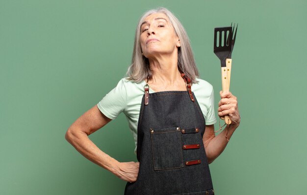 Gray hair pretty barbecue chef woman