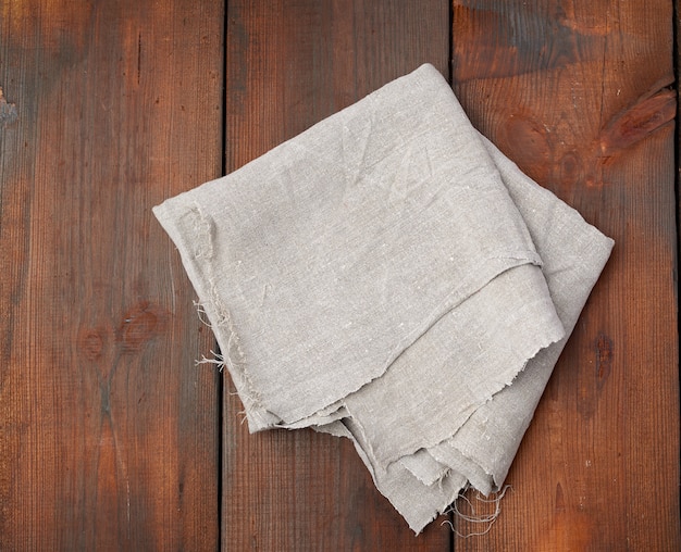 Gray linen towel on wooden boards