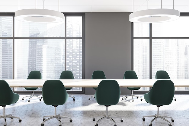 Gray loft conference room interior with a concrete floor and a long white table with black chairs standing around it. 3d rendering mock up