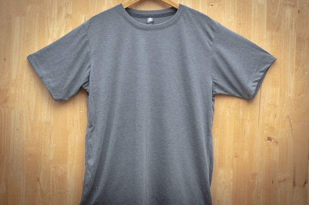 gray short sleeve t-shirt plain round neck mock up concept idea wooden back ground  front view