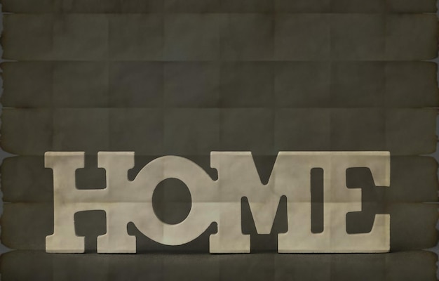 A gray sign that says home is sitting on a black background.