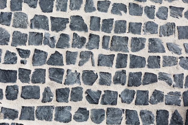 Gray square stones paved road