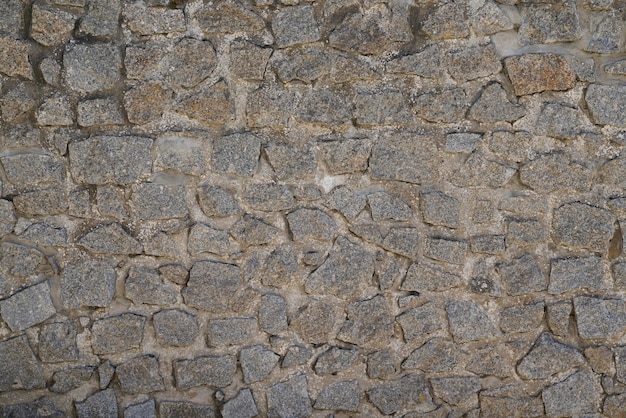 Gray stone wall background like wallpaper grey