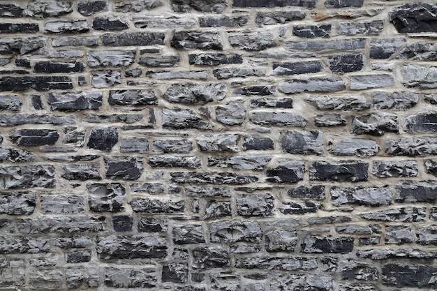 Photo gray stone wall background.