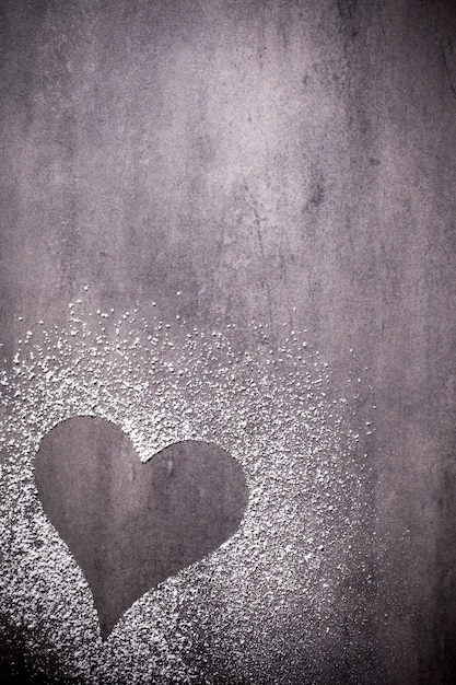 On the gray surface of the heart shape.