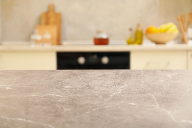 Gray table on blurred kitchen interior background