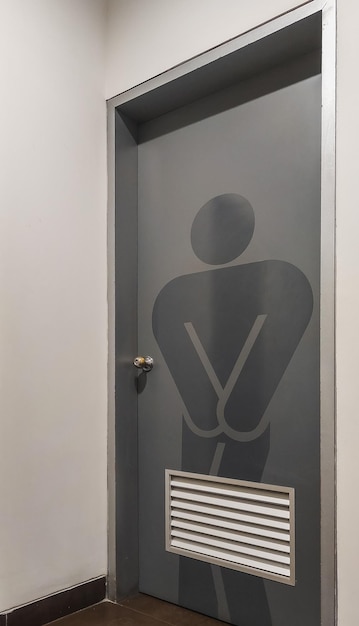 gray toilet signs for men printed on doors  inside a building