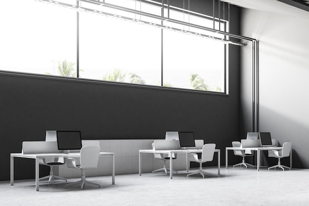 Интерьер офиса в индустриальном стиле серой стены с бетонным полом, длинным узким окном и скатной крышей. Угловой вид. 3D-рендеринг макета