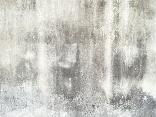 A gray wall with a white textured background