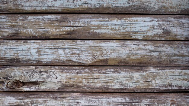 Fondo di legno grigio con vecchie plance dipinte