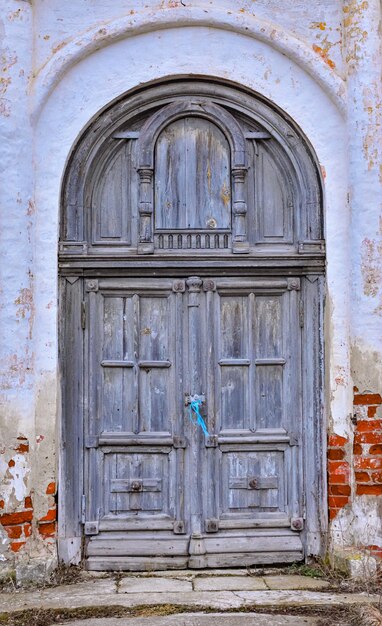 gray wooden door in the wall