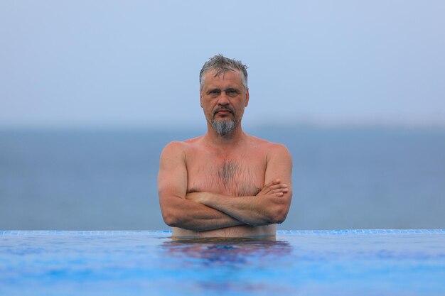 grayhaired man in the pool