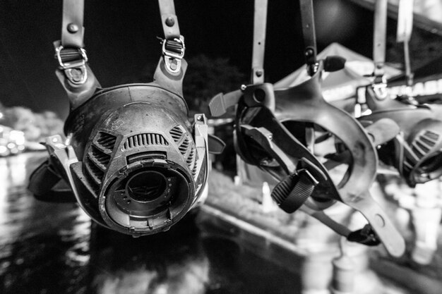 Photo grayscale of hanging scba gas masks