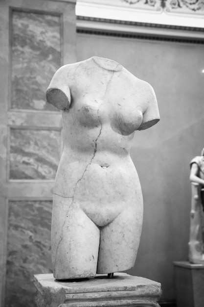 Grayscale shot of a marble statue of a female