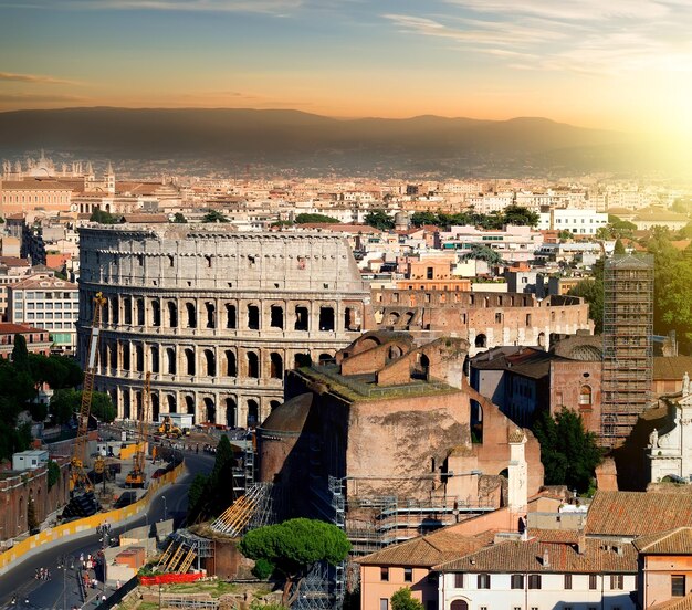 Great ancient colosseum in Rome at sunset, Italy