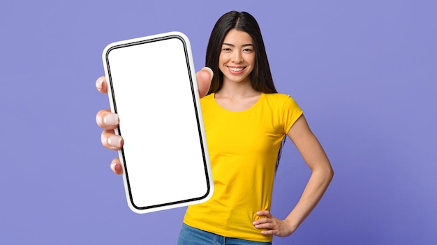 Great App Happy Korean Woman Holding Smartphone With Blank Screen