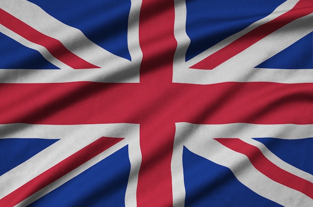 Great britain flag is depicted on a sports cloth fabric with many folds.