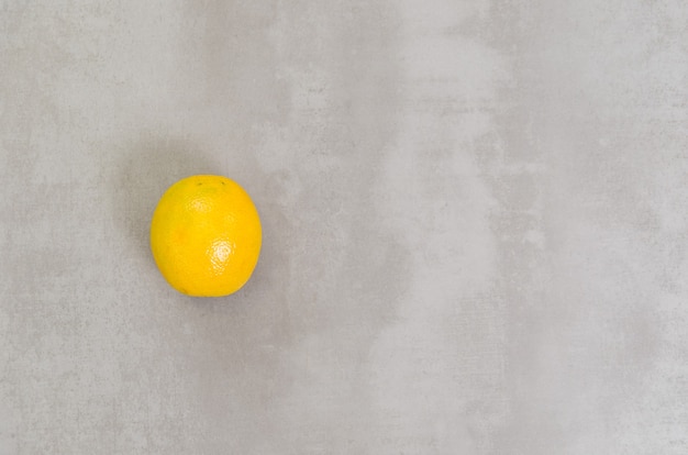 Great concept of healthy eating, orange in gray background. With copy space.