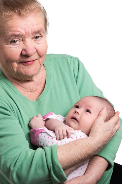 Photo great grandmother sitting and tenderly holding newborn grandson isolated on white background