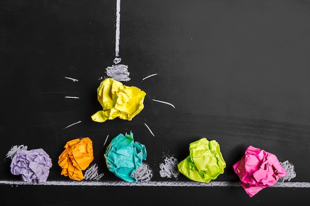 Great idea concept, crumpled paper on the chalkboard 