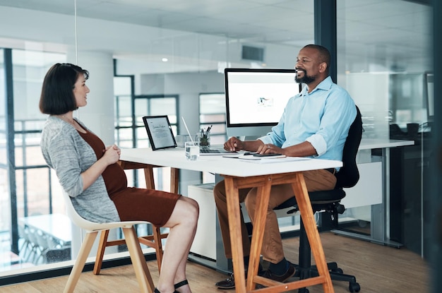 Great ideas come up in conversations Cropped shot of two young businesspeople sitting in the office together and having a discussion