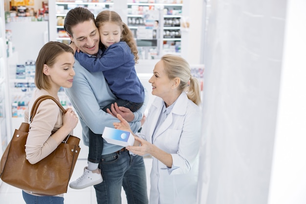 Great medication. Positive family listening to female pharmacist and staring down