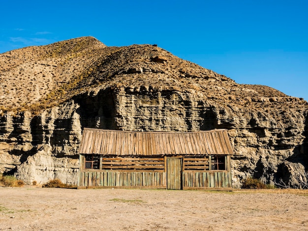 Great view of tabernas desert with wooden shelter for movie set place in almeria andalusia spain