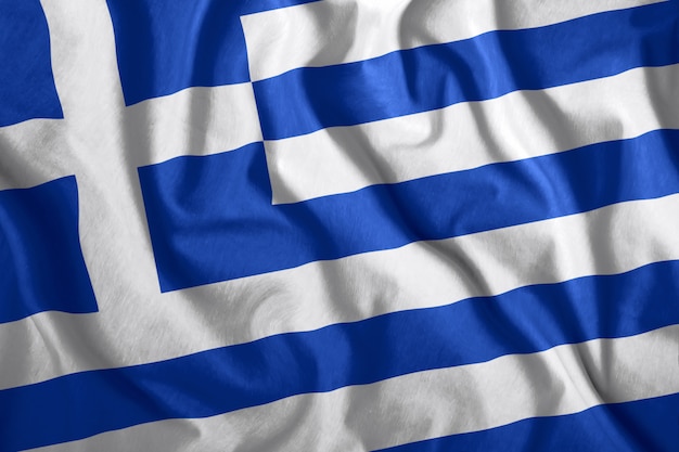 ギリシャの旗が風になびいて