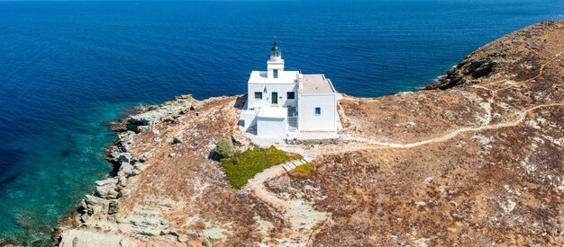 Greece kea tzia island lighthouse on rocky cape sky sea background