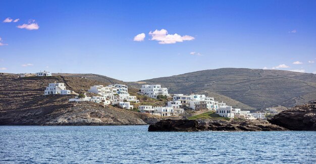 Greece Kythnos island Loutra port White buildings on the rocky hill view from the sea Cyclades